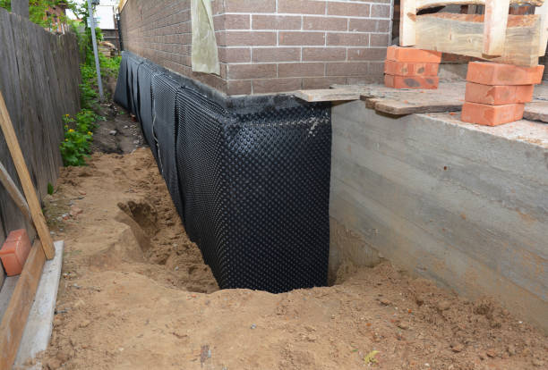 Happy homeowners after waterproofing job in Canisteo